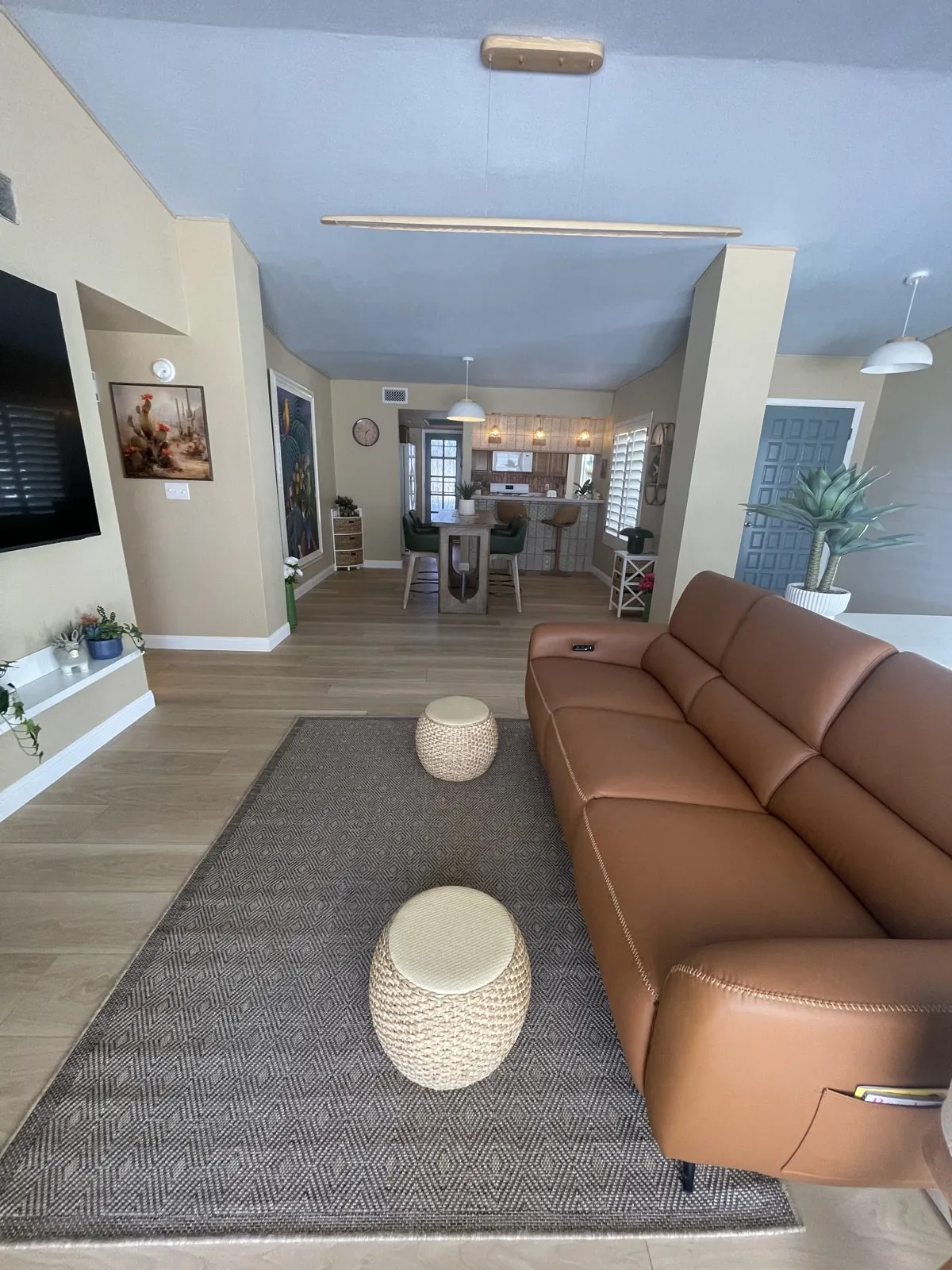 Open-plan living, dining and kitchen area with wood-look LVP flooring in a Phoenix, AZ home, an RDC project